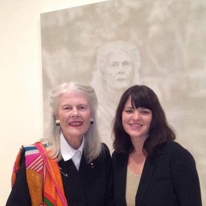 Fiona Lowry standing with Penelope Seidler in front of her winning portrait. 
