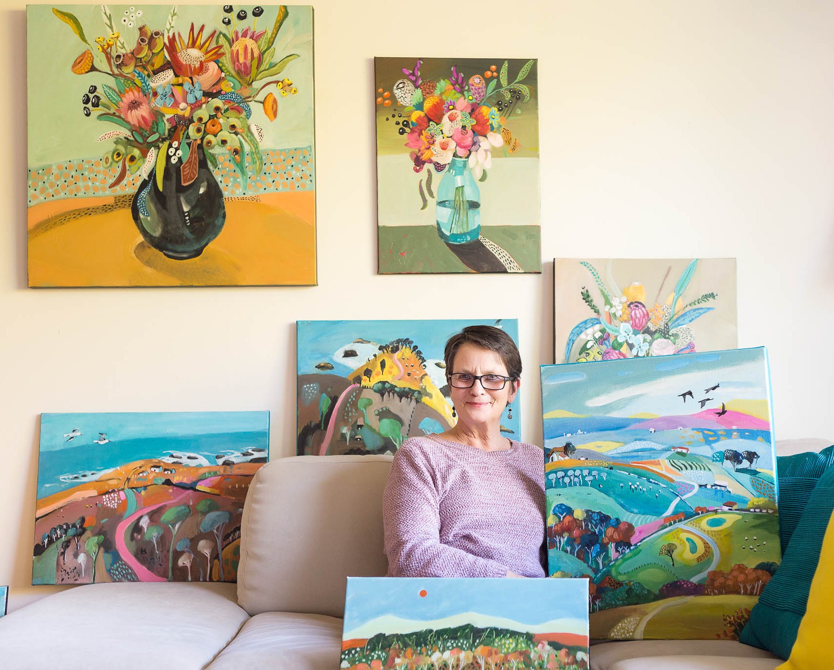 Susan Trudinger amongst a collection of her artworks.