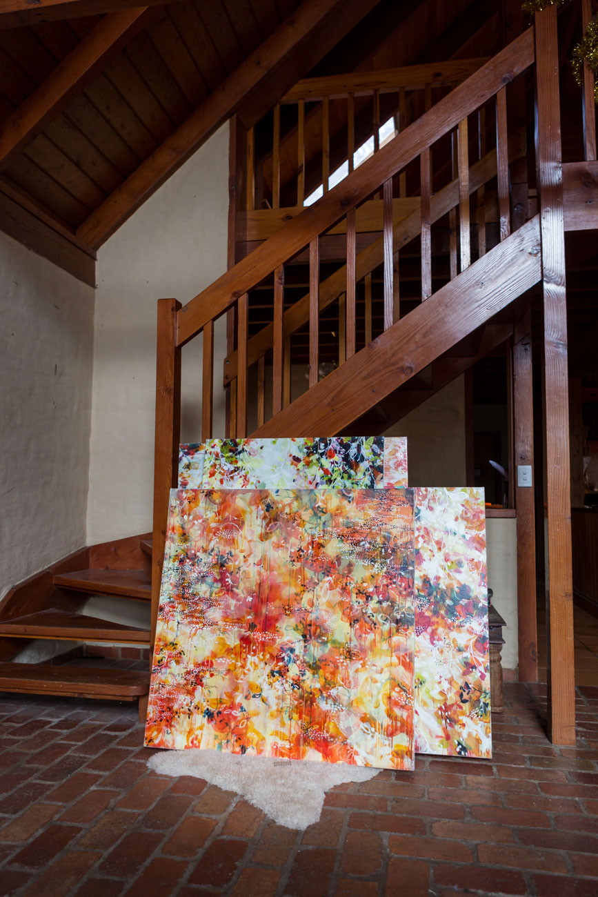 artworks leaning against staircase