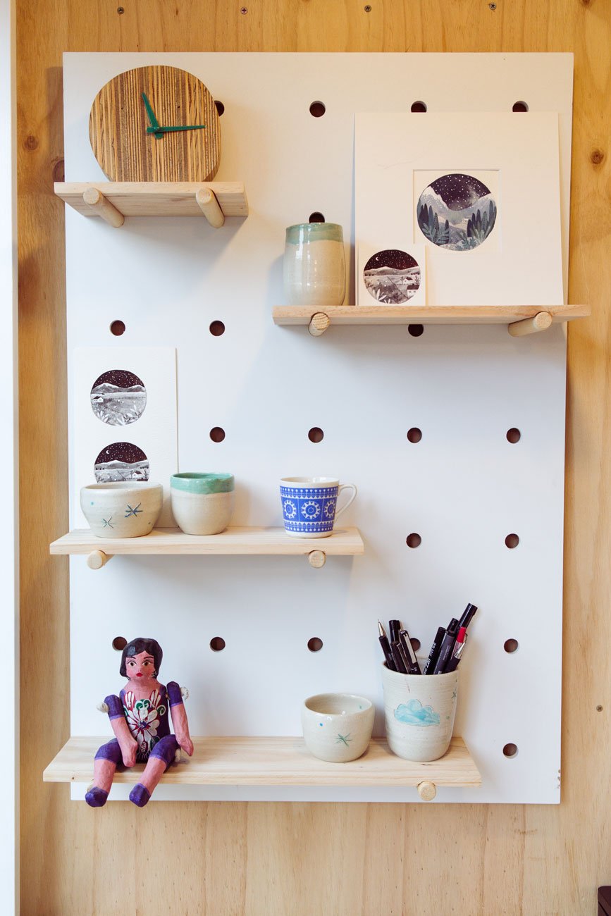 Shelf with pots and small watercolours