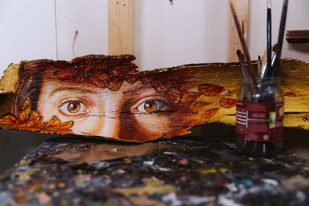 portrait painted on strip of bark