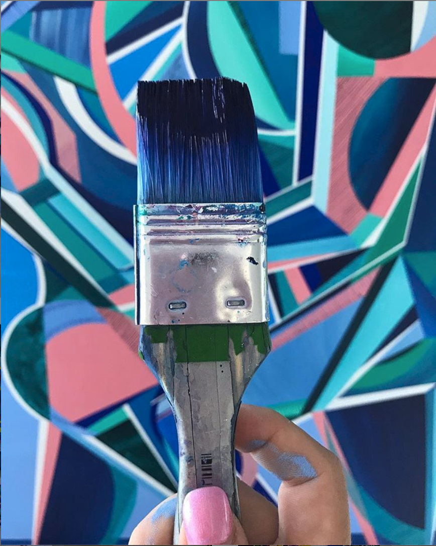 Paintbrush in studio of Rebecca Trajkovski. Paintings for sale on Bluethumb.