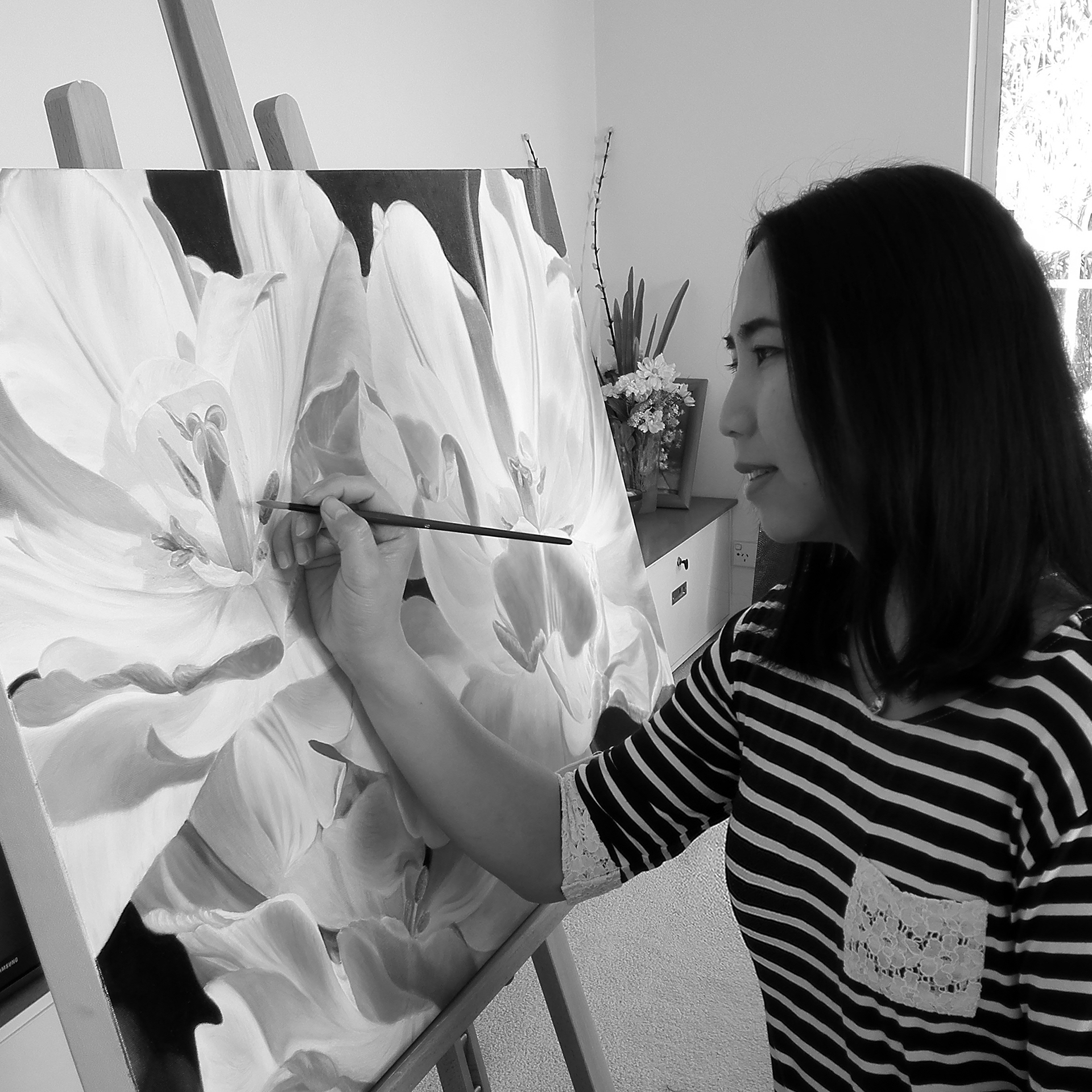 Local Sydney artist Natasha Junmanee at work on a painting