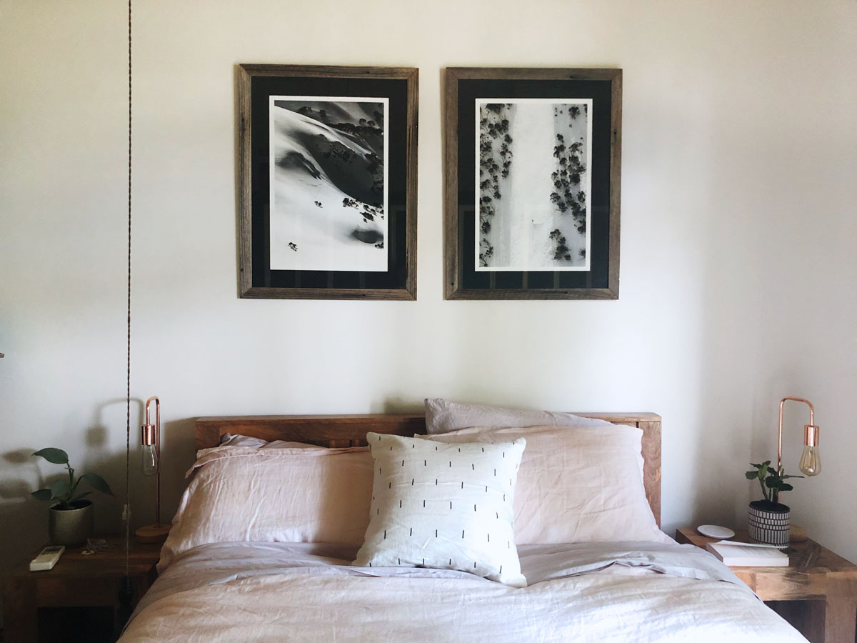 Bedroom with monochrome snow photographs