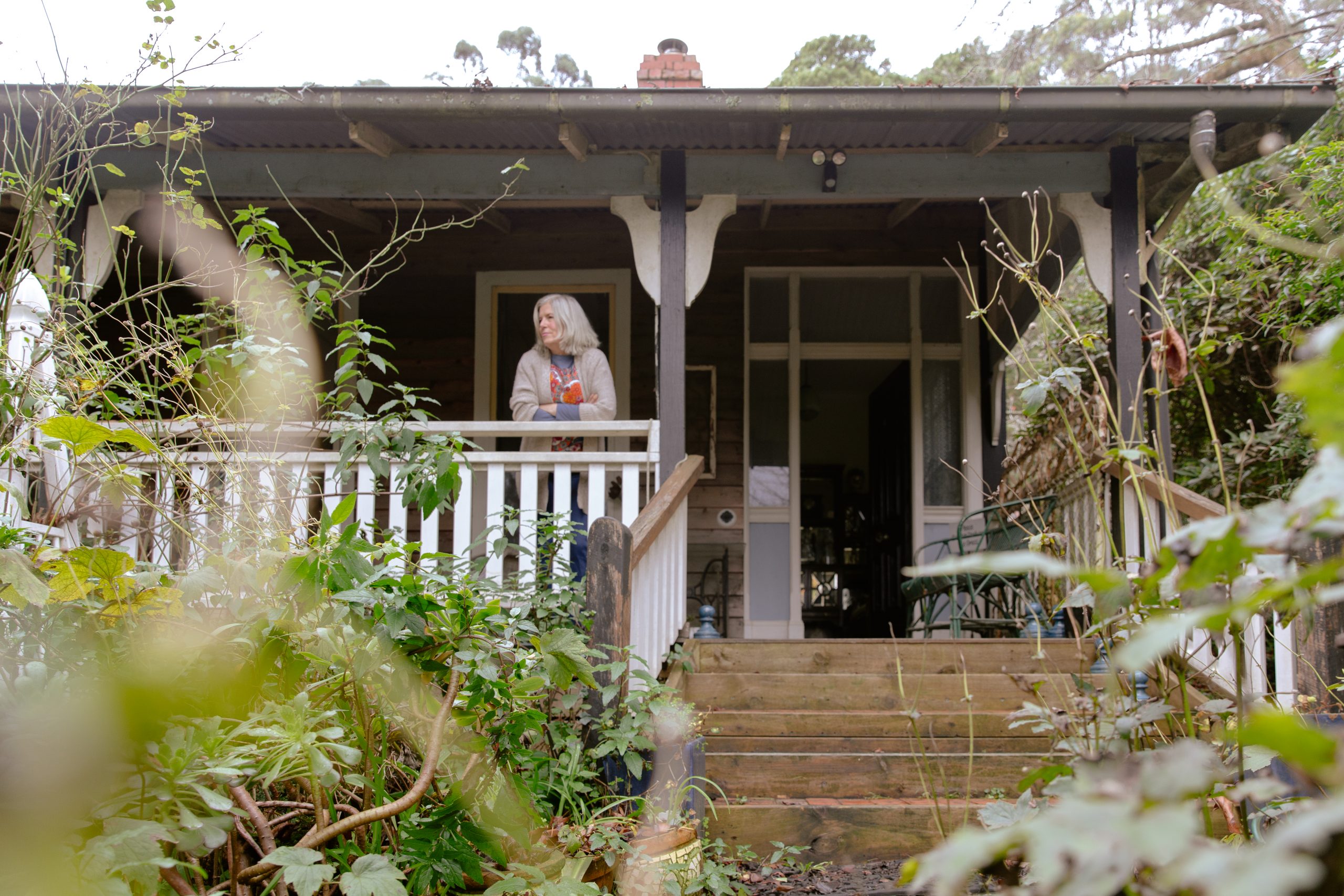 Alicia Cornwell standing on the porch of her Olinda home