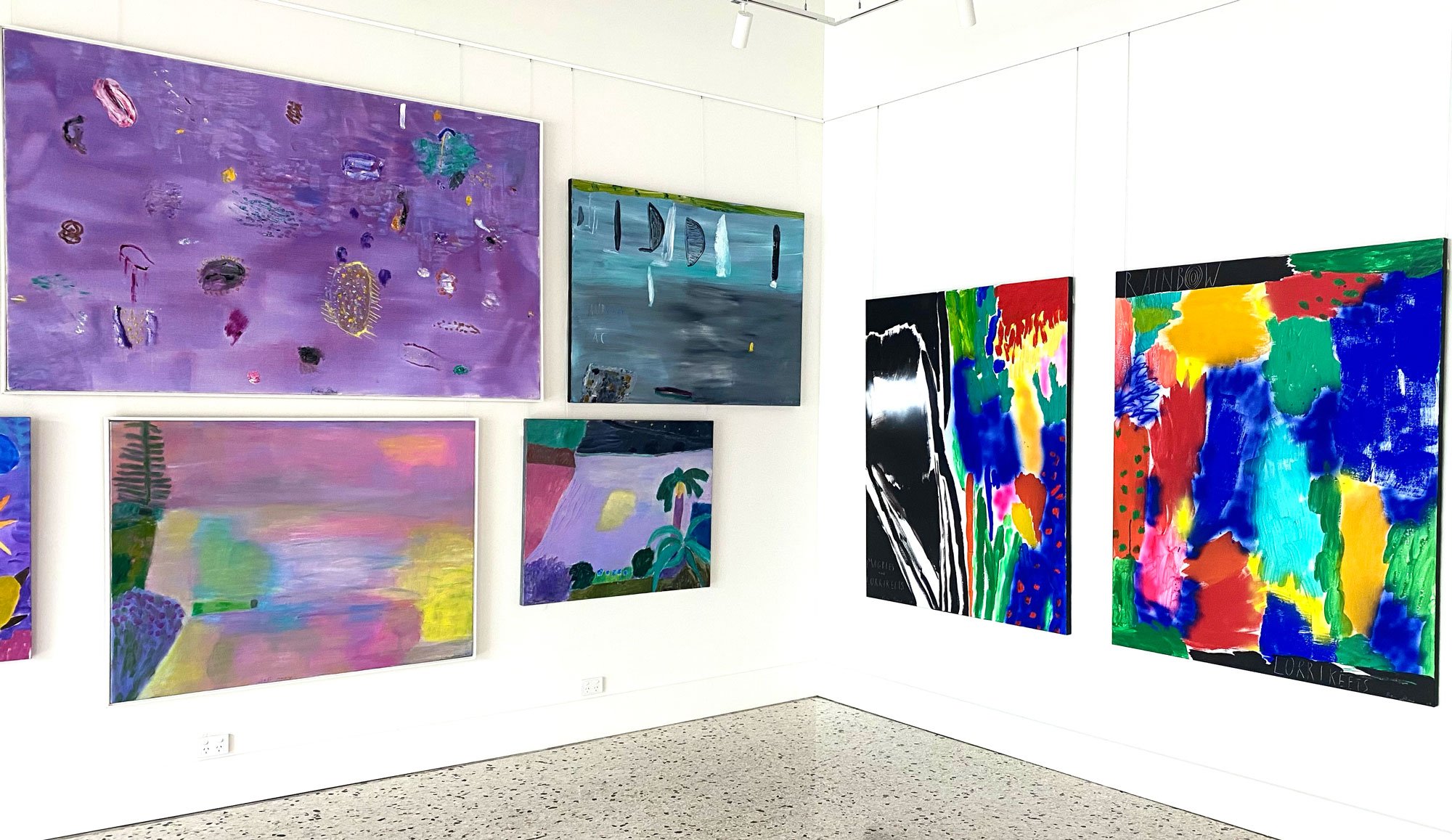 A selection of Ken Done's artworks hanging on the walls of the Bluethumb's Richmond gallery.