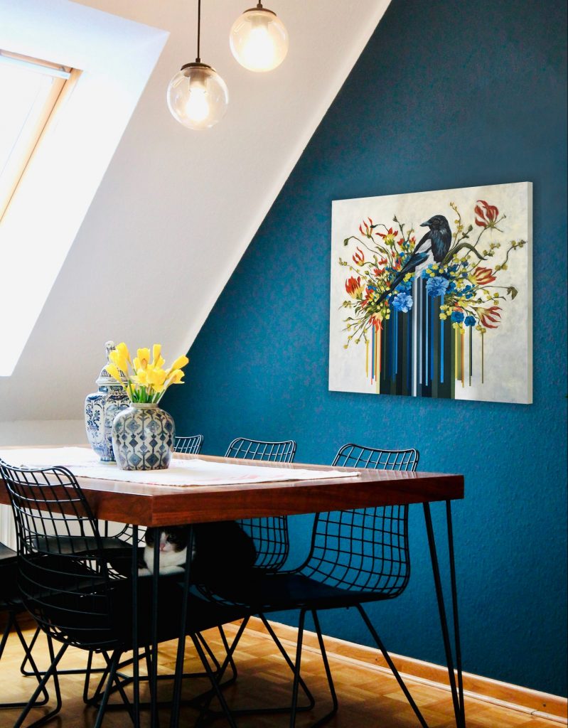 Garden Visitor by April White against a feature wall in this dining room.