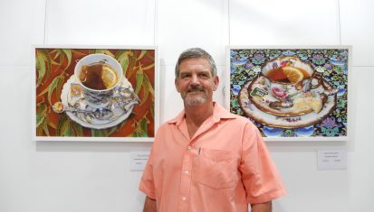 artist in front of work